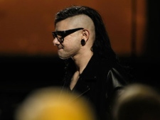 Skrillex is seen before accepting the award for best dance recording at the 54th annual Grammy Awards pre-show on Sunday, Feb. 12, 2012 in Los Angeles. (AP Photo/Matt Sayles)