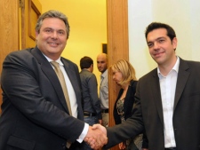 Alexis Tsipras (right), leader of Greece's Coalition of the Radical Left party, SYRIZA, and Evangelos Venizelos, leader of the right-wing party of "Independent Greeks" smile as they shake hands before a meeting at the Greek Parliament in Athens, Wednesday, May 9, 2012. (AP Photo/Evi Fylaktou)