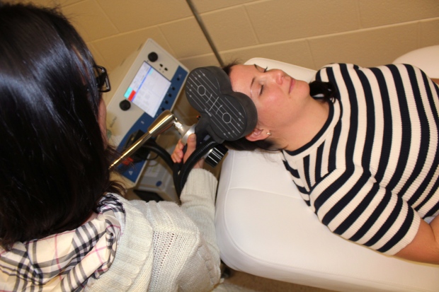 A technician at the Centre for Addiction and Mental Health (CAMH) demonstrates the use of transcranial magnetic stimulation, for treating depression, on a healthy volunteer. THE CANADIAN PRESS/HO-Centre for Addiction and Mental Health