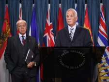 Public Safety Minister Vic Toews, accompanied by Sen. Jean-Guy Dagenais, speaks at a news conference Wednesday, May 9, 2012, on Parliament Hill in Ottawa. (MARKETWIRE PHOTO/Public Safety Canada)