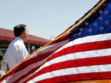 Republican presidential candidate, former Massachusetts Gov. Mitt Romney addresses supporters in the overflow area at a campaign stop in Omaha, Neb., on Thursday, May 10, 2012. (AP Photo/Jae C. Hong)
