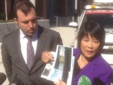 NDP MP Olivia Chow, right, and NDP MPP Jonah Schein speak to reporters about the crumbling elevated section of the Gardiner Expressway in Toronto on Friday, May 11, 2012. (CP24/Cam Woolley)