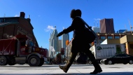 In this file photo, a woman walks in downtown Toronto during an extreme cold weather alert. (Frank Gunn / THE CANADIAN PRESS)