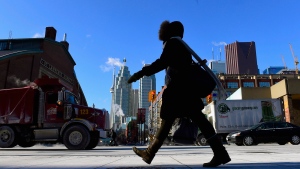 In this file photo, a woman walks in downtown Toronto during an extreme cold weather alert. (Frank Gunn / THE CANADIAN PRESS)