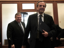 Conservative election winner Antonis Samaras, right, leaves the office of Socialist leader Evangelos Venizelos after their meeting on Friday, May 11, 2011. Greek political leaders are continuing power-sharing negotiations after a May 6 general election gave no party an outright majority to govern. Failure to reach a coalition agreement would trigger fresh general elections next month. (AP Photo/Dimitri Messinis)