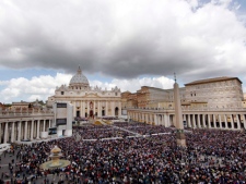 Faithful gather in St. Peter's Square at the Vatican during the Easter Mass celebrated by Pope Benedict XVI on Sunday, April 8, 2012. (AP Photo/Pier Paolo Cito)