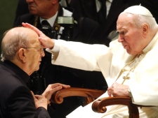 In this Nov. 30, 2004, file photo, the late Pope John Paul II gives his blessing to late father Marcial Maciel, founder of Christ's Legionaries, at the Vatican during a special audience the pontiff granted to participants of the Regnum Christi movement. The Vatican is investigating seven priests from the troubled Legion of Christ religious order for alleged sexual abuse of minors and another two for other alleged crimes, The Associated Press has learned. (AP Photo/Plinio Lepri, File)