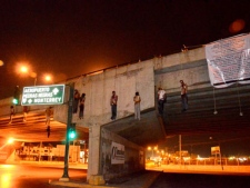 The bodies of nine unidentified people hang from a bridge in Nuevo Laredo, Mexico, Friday, May 4, 2012. (AP Photo)