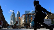 A woman walks in downtown Toronto on Wednesday, Jan. 7, 2015. (Frank Gunn /The Canadian Press)