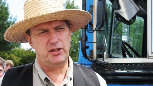 Farmer Michael Schmidt talks to reporters on outside court in Newmarket, Ont., Thursday, July 31, 2008. (Colin Perkel / THE CANADIAN PRESS)  