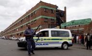 An Armed police officer is shown in Johannesburg in this file photo. (AP Photo/Themba Hadebe)