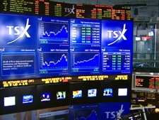 Boards at the Toronto Stock Exchange show volatile trading activity on Friday, Oct. 31, 2008.