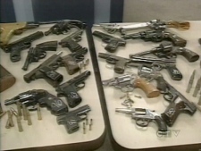 At a Tuesday, Nov. 11, 2008 news conference, police at 54 Division displayed 20 handguns surrendered by an area resident. 