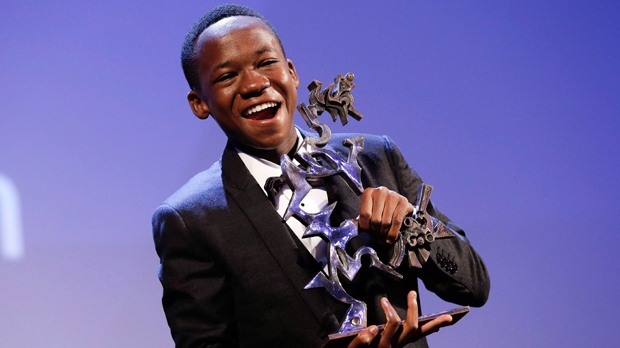 Actor Abraham Attah receives the Mastroianni Prize for best emerging actor for his role in the movie "Beasts of No Nation," during the awards ceremony of the 72nd edition of the Venice Film Festival in Venice, Italy, Saturday, Sept. 12, 2015. THE CANADIAN PRESS/AP/Andrew Medichini