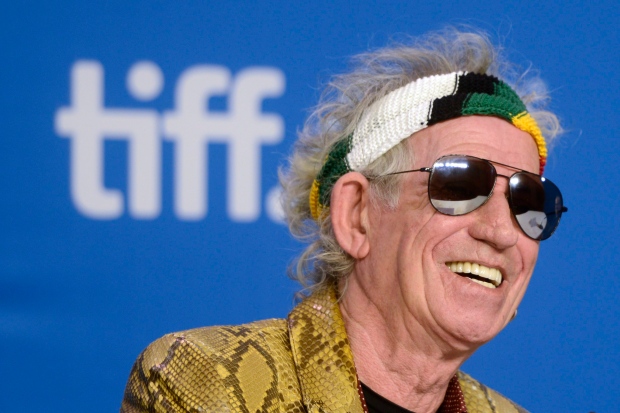Keith Richards smiles during the press conference for the film "Keith Richards: Under the Influence" at the 2015 Toronto International Film Festival on Thursday, Sept. 17, 2015. (Marta Iwanek/The Canadian Press via AP)