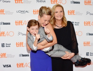 Brie Larson, and Joan Allen, right, hold Jacob Tremblay at the premiere for "Room" on day 6 of the Toronto International Film Festival at the Princess Of Wales Theatre on Tuesday, Sept. 15, 2015, in Toronto. (Photo by Evan Agostini/Invision/AP)