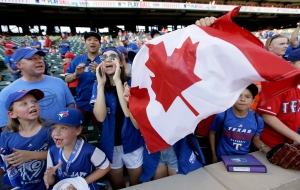 
Toronto Blue Jays fans cheer the team before Game 3 of baseball's American League Division Series against the Texas Rangers, Sunday, Oct. 11, 2015, in Arlington, Texas. (AP Photo/LM Otero)
