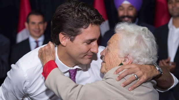Liberal Leader Justin Trudeau hugs former Mississauga mayor Hazel McCallion during a campaign event in a senior's home Friday, Oct. 16, 2015 in Mississauga, Ont. (The Canadian Press/Paul Chiasson)