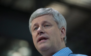 Conservative leader Stephen Harper attends a campaign event in Quebec City on Friday, Oct. 16, 2015. Almost one month after the Conservative government announced measures to accelerate the resettling of Syrian refugees in Canada, it still has not doubled the number of staff handling sponsorship applications.THE CANADIAN PRESS/Jonathan Hayward