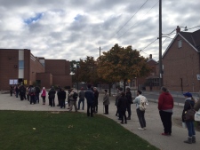 Voters wait to cats their ballots at a Toronto polling station Monday october 19, 2015. (Mathew Reid /CP24)