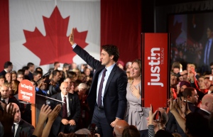 Liberal leader Justin Trudeau and wife Sophie Gregoire waves to the crowd after his speech at Liberal election headquarters in Montreal, Que. on Monday, October 20, 2015. THE CANADIAN PRESS/Sean Kilpatrick