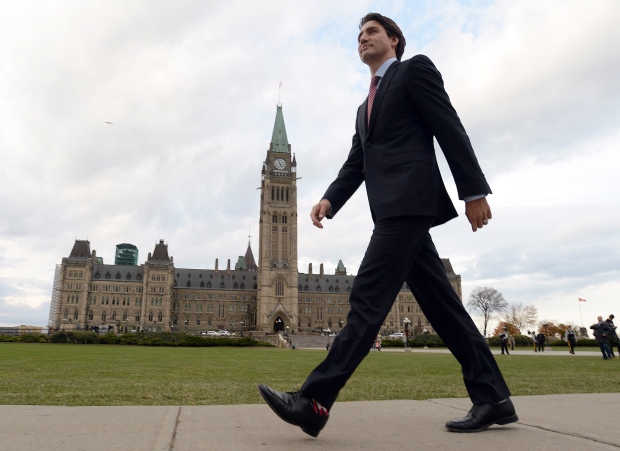 Prime minister designate Justin Trudeau makes his way from Parliament Hill to the National Press Theatre to hold a press conference in Ottawa on Tuesday, October 20, 2015. THE CANADIAN PRESS/Sean Kilpatrick