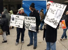 Demonstrators were armed with creative signage at the pro-coalition event.