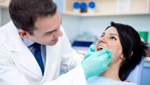 FILE- Bioactive glass, which is more resistant to bacteria, could be used in the tooth fillings of the future, according to new research. (Lucky Business/Shutterstock.com)