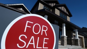 A sign advertises a new home for sale in Carleton Place, Ont., on March 17, 2015. (THE CANADIAN PRESS/Sean Kilpatrick)