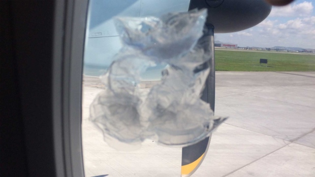 Hole in plane window