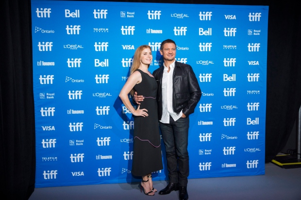 Actors Amy Adams, left, and Jeremy Renner, right, attend a press conference to promote the new science fiction drama "Arrival" at the Toronto International Film Festival on Monday, Sept. 12, 2016. (The Canadian Press/Michelle Siu)