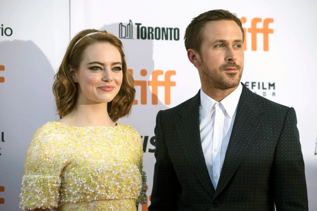 Ryan Gosling, right, and Emma Stone arrive on the red carpet for the film "La La Land" during the 2016 Toronto International Film Festival in Toronto on Monday, Sept. 12, 2016. (Chris Young/The Canadian Press via AP)