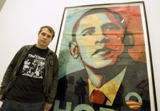 Artist Shepard Fairey poses beside his "Obama HOPE" image, part of an exhibit of his work at the Institute of Contemporary Art Tuesday, Feb. 3, 2009, in Boston. (AP / Boston Herald, Matt Stone)