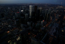 Office towers begin to dim their lights as seen from the CN Tower during Earth Hour, Saturday, March 29, 2008. (J.P. Moczulski / THE CANADIAN PRESS)  