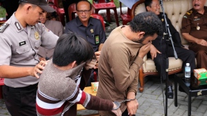 Gay men caned in Indonesia