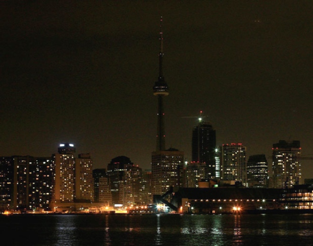 The skyline of Toronto's downtown is dimmed as many of the lights are turned off for Earth Hour on Saturday, March 28, 2009. (Darren Calabrese / THE CANADIAN PRESS)