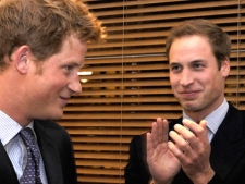 Britain's Prince William, right, applauds after his brother Prince Harry, left, delivered a speech in London, Thursday, Jan. 8, 2009. (AP / Toby Melville)
