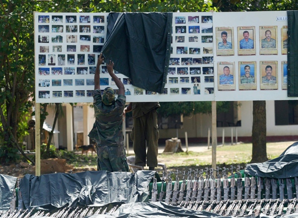 Sri Lankan soldiers prepare a display consisting of arms taken from Tamil Tiger rebels in Killinochchi about 230 kilometres northeast of Colombo, Sri Lanka, Friday, April 24, 2009. (AP / Eranga Jayawardena)