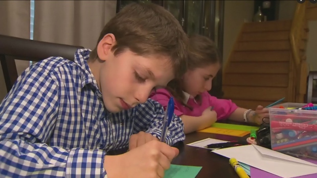 Maple twins Tamara and Jeremy Cohn write cards to other kids who need a boost. 