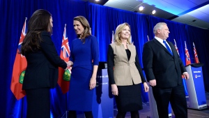 Ontario PC leadership candidates Tanya Granic Allen and Caroline Mulroney shake hands as Christine Elliott and Doug Ford leave the stage following a debate in Ottawa on Wednesday, Feb. 28, 2018. THE CANADIAN PRESS/Justin Tang