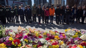Flowers line a memorial at Mel Lastman Square in Toronto on Thursday, April 26, 2018 for the victims of Monday's deadly van attack. THE CANADIAN PRESS/Cole Burston
