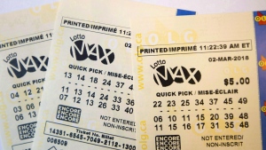 FILE - A Lotto Max ticket is shown in Toronto on Monday Feb. 26, 2018. (THE CANADIAN PRESS)