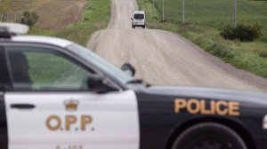An OPP vehicle blocks a road north of London, Ont.