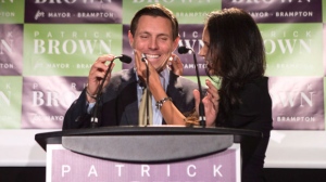 Brampton Mayor Patrick Brown stands on stage with his wife Genevieve Gualtieri after winning the Brampton Mayoral Election during a campaign celebration in Brampton, Ont. on Monday October 22 , 2018. THE CANADIAN PRESS/Chris Young