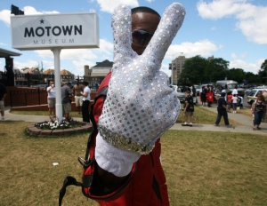 Tyuawn Brown, 28, a Michael Jackson impersonator raises his hand in peace with the signature sequenced glove at Detroits Motown Museum on Tuesday, July 7, 2009 in Detroit. (Detroit Free Press / Regina H. Boone)  