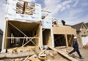 Constuction workers build a new home in Oakville, Ont., in April. (THE CANADIAN PRESS / Nathan Denette)