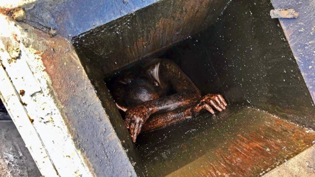 Man stuck in grease vent