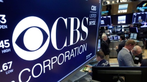 In this July 30, 2018, photo the logo for CBS Corporation is displayed above a trading post on the floor of the New York Stock Exchange. (AP Photo/Richard Drew, File)