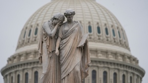 The U.S. Capitol Dome is seen behind the Peace Monument statue in Washington, Monday, Dec. 31, 2018, as a partial government shutdown stretches into its second week. A high-stakes move to reopen the government will be the first big battle between Nancy Pelosi and President Donald Trump as Democrats come into control of the House. The new Democratic House majority gavels into session this week with legislation to end the government shutdown. Pelosi and Trump both think they have public sentiment on their side in the battle over Trump's promised U.S.-Mexico border wall. (AP Photo/J. Scott Applewhite)