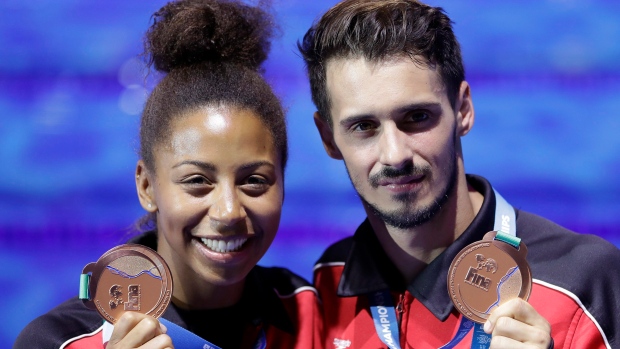 Canada's bronze medallists Jennifer Abel, left, and Francois Imbeau-Dulac hold their medals after the award ceremony for the mixed 3 meter springboard diving final at the 17th FINA World Championships 2017 in Budapest, Hungary, Saturday, July 22, 2017. It might have seemed like an innocuous gesture. But it was part of a much bigger problem that saw Canadian Francois Imbeau-Dulac lay down some of the best dives of his life at the 2012 London Olympics ??? and then completely fall apart. THE CANADIAN PRESS/AP/Michael Sohn
